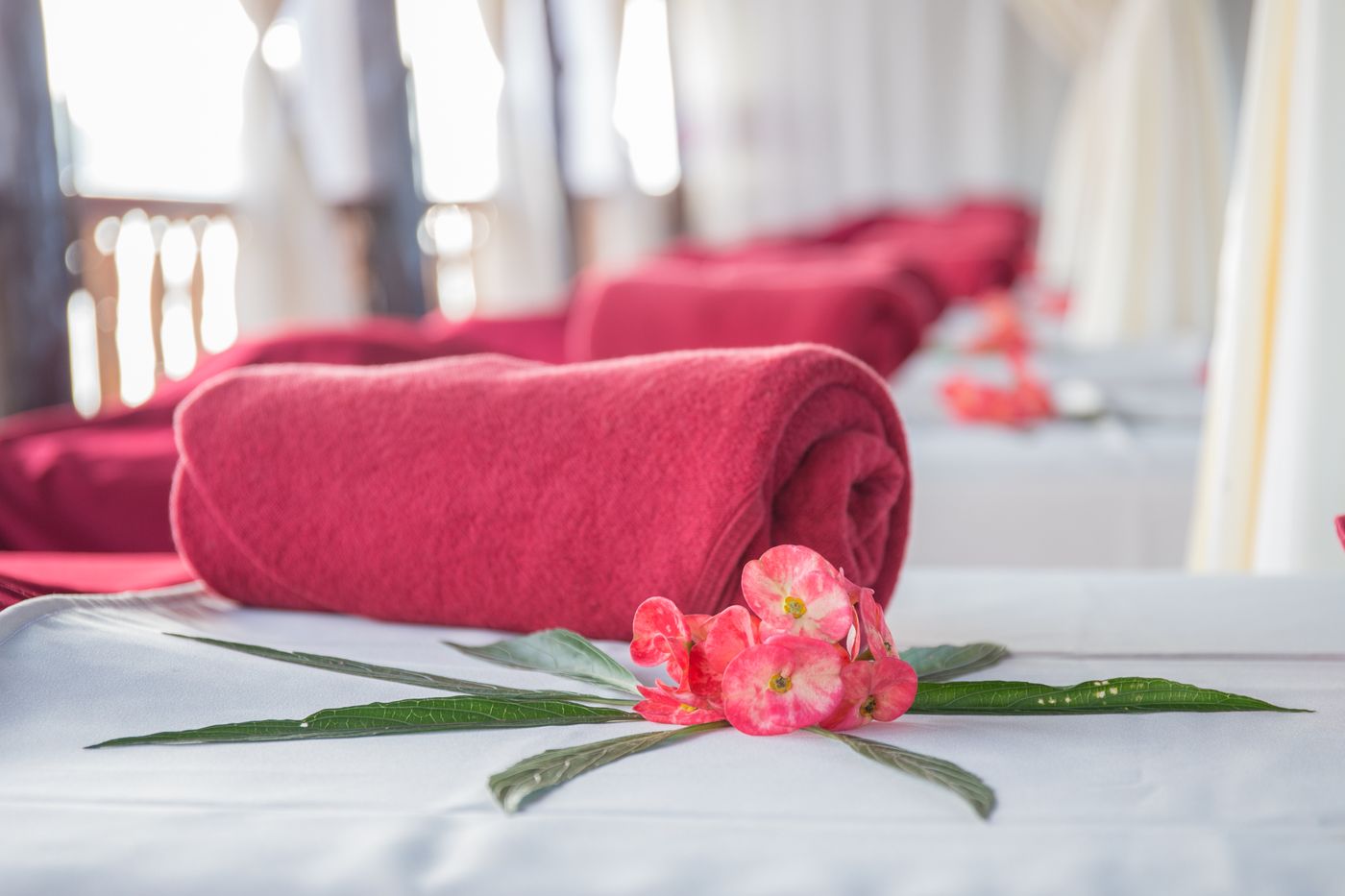 Soft towels and a flower arranged for a beauty ritual
